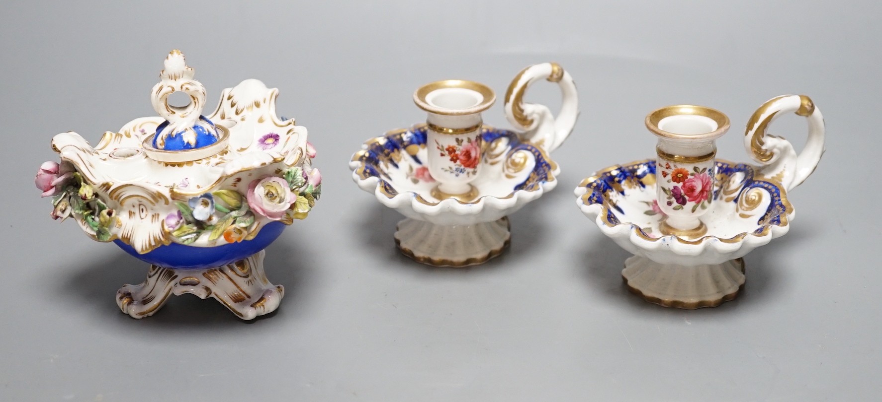 A Coalport floral encrusted inkwell cover and liner, marked C-Dale in blue and two English porcelain tapersticks painted with roses perhaps Coalport, c.1820